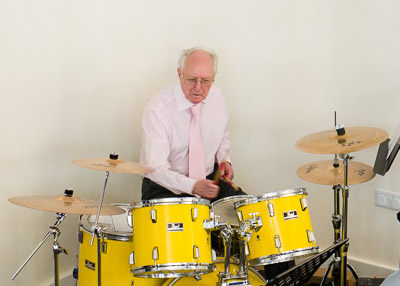 Norman playing the drums
